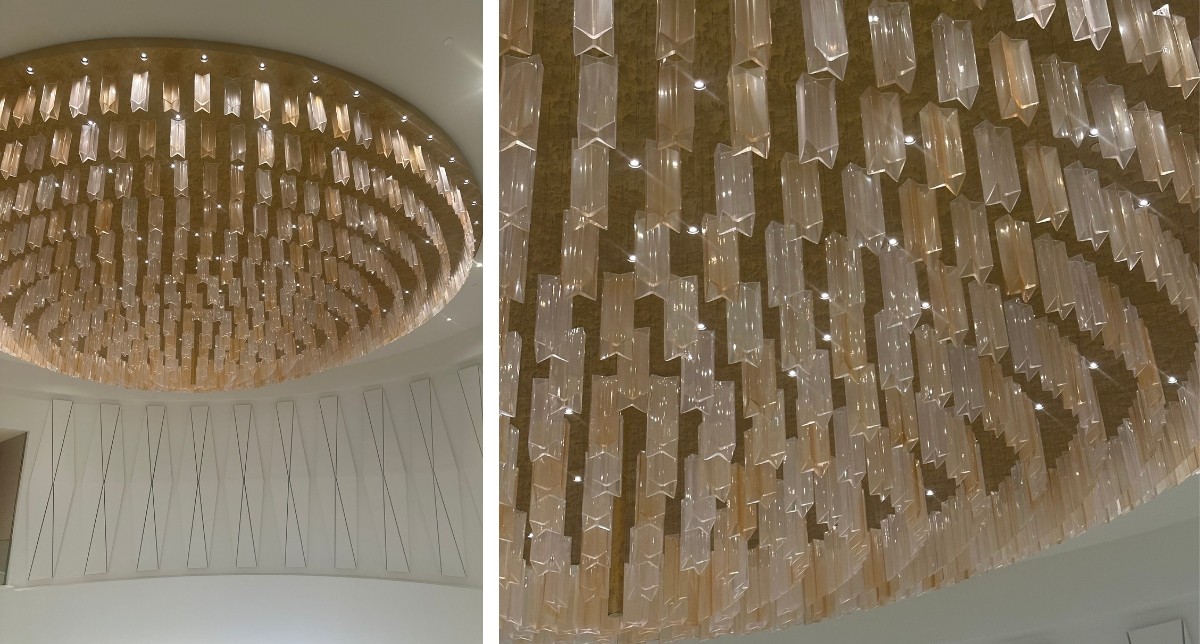 Yet another stunning bowtie chandelier, with a bowtie pattern noticeably on the wall behind it